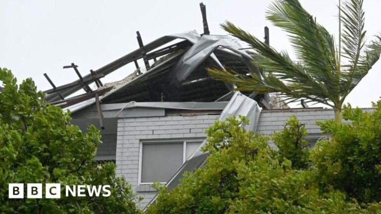 Read more about the article Body found in floodwaters and troops injured in Australia storm